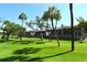 Beautiful golf course view with well-maintained greens and mature trees, offering a tranquil outdoor setting at 2103 Harbourside Dr # 1102, Longboat Key, FL 34228