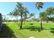 Beautiful golf course view with lush green grass and mature trees at 2103 Harbourside Dr # 1102, Longboat Key, FL 34228