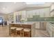 Spacious eat-in kitchen boasts a center island with stool seating and stainless steel appliances at 2103 Harbourside Dr # 1102, Longboat Key, FL 34228
