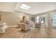 Spacious living area with a skylight, herringbone wood flooring, and contemporary furnishings at 2103 Harbourside Dr # 1102, Longboat Key, FL 34228