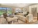 Bright living room with large windows, modern furniture and a neutral color palette at 2103 Harbourside Dr # 1102, Longboat Key, FL 34228
