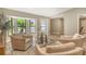 Bright living space with comfortable chairs and large windows that let in plenty of natural light at 2103 Harbourside Dr # 1102, Longboat Key, FL 34228