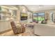Beautiful living room featuring a golf course view, stylish furniture and custom cabinets at 2103 Harbourside Dr # 1102, Longboat Key, FL 34228