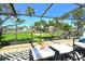 Relax on the screened patio with golf course views and comfortable seating at 2103 Harbourside Dr # 1102, Longboat Key, FL 34228