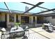 Spacious, covered patio is perfect for outdoor dining and relaxation at 2103 Harbourside Dr # 1102, Longboat Key, FL 34228