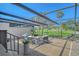 Relaxing outdoor patio area with comfortable seating, patterned rug, and views of lush golf course at 2103 Harbourside Dr # 1102, Longboat Key, FL 34228