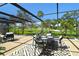 Charming outdoor dining with seating, lush green golf course views offering a perfect blend of relaxation at 2103 Harbourside Dr # 1102, Longboat Key, FL 34228