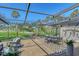 Screened patio boasts seating and dining areas, plus lovely golf course views at 2103 Harbourside Dr # 1102, Longboat Key, FL 34228