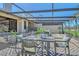 Inviting patio with elegant dining set, lounge furniture, and picturesque views of the surrounding golf course at 2103 Harbourside Dr # 1102, Longboat Key, FL 34228