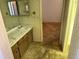 Bathroom with double sinks and floral wallpaper at 211 55Th Nw St, Bradenton, FL 34209
