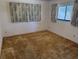 Spacious bedroom featuring neutral walls and window for natural light at 211 55Th Nw St, Bradenton, FL 34209