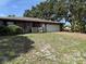 Side view of a single story home with a two-car garage and a driveway at 211 55Th Nw St, Bradenton, FL 34209