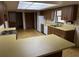 Open kitchen with laminate countertops, white appliances, and unique light fixture at 211 55Th Nw St, Bradenton, FL 34209