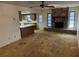Cozy living room features a stone fireplace and access to the kitchen at 211 55Th Nw St, Bradenton, FL 34209