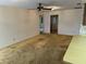 Spacious living room with ceiling fan and access to multiple rooms at 211 55Th Nw St, Bradenton, FL 34209