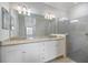 Bathroom with double vanity, granite countertop and walk-in shower at 2316 Springhaven Ln, Lakewood Ranch, FL 34211