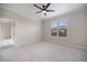 Bedroom with ceiling fan and natural light at 2316 Springhaven Ln, Lakewood Ranch, FL 34211