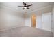 Bedroom with ceiling fan and neutral carpet at 2316 Springhaven Ln, Lakewood Ranch, FL 34211