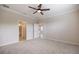 Bedroom with ceiling fan and entry to bathroom at 2316 Springhaven Ln, Lakewood Ranch, FL 34211