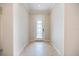 Bright foyer featuring decorative front door and light tile flooring at 2316 Springhaven Ln, Lakewood Ranch, FL 34211