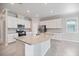 Open kitchen with granite countertops, stainless steel appliances and white cabinetry at 2316 Springhaven Ln, Lakewood Ranch, FL 34211