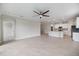 Bright, open living space connecting to a modern kitchen with stainless steel appliances at 2316 Springhaven Ln, Lakewood Ranch, FL 34211