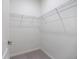 Walk-in closet with wire shelving and neutral carpet at 2316 Springhaven Ln, Lakewood Ranch, FL 34211