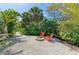 Backyard featuring a cozy fire pit area, perfect for outdoor entertaining and relaxation at 2321 Milford Cir, Sarasota, FL 34239