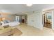 Spacious bedroom with closet, dresser, en suite, natural light, and neutral color scheme at 2321 Milford Cir, Sarasota, FL 34239