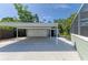 Carport featuring a convenient two-car space next to the garage for accessible parking at 2321 Milford Cir, Sarasota, FL 34239