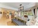 Open-concept dining area with pendant lighting, built-in shelving, and a spacious layout at 2321 Milford Cir, Sarasota, FL 34239