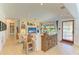 Comfortable living area with built-in shelving, plenty of natural light, and a cozy atmosphere at 2321 Milford Cir, Sarasota, FL 34239