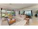 Bright living room with cozy seating, natural light, and open floorplan at 2321 Milford Cir, Sarasota, FL 34239