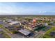 Aerial view of condo community with lake views, local businesses, and easy access to major roads at 2395 Harbor Blvd # 314, Port Charlotte, FL 33952