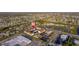 Aerial view of the condo complex within a community near local shops, roads, and green spaces at 2395 Harbor Blvd # 314, Port Charlotte, FL 33952