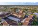 An aerial view of the condo complex with parking and community living amongst other homes at 2395 Harbor Blvd # 314, Port Charlotte, FL 33952