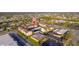 Aerial view of condo complex shows parking, community amongst other homes, and local shopping at 2395 Harbor Blvd # 314, Port Charlotte, FL 33952