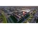 Aerial view of a complex with covered parking, green spaces, and easy access to nearby amenities at 2395 Harbor Blvd # 314, Port Charlotte, FL 33952