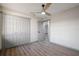 Bedroom boasting wood floors, a ceiling fan, and a closet with double doors at 2395 Harbor Blvd # 314, Port Charlotte, FL 33952