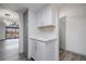 Bright living area features hardwood floors, a wet bar, and balcony access at 2395 Harbor Blvd # 314, Port Charlotte, FL 33952