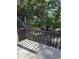 A view of the secluded backyard with a wood fence at 2613 Pine Lake Ter # C, Sarasota, FL 34237
