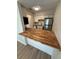 The kitchen includes stainless steel appliances, wooden countertops, and white cabinets at 2613 Pine Lake Ter # C, Sarasota, FL 34237