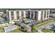 An aerial view of the condo building, community pool, and ample parking spaces at 2901 26Th W St # 204, Bradenton, FL 34205