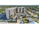 An aerial view showcasing the condo building, pool, and surrounding neighborhood at 2901 26Th W St # 204, Bradenton, FL 34205