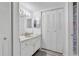 Bright bathroom featuring a vanity with storage and a large mirror at 2901 26Th W St # 204, Bradenton, FL 34205