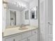 Bright bathroom featuring a vanity with storage and a large mirror at 2901 26Th W St # 204, Bradenton, FL 34205