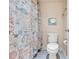 Functional bathroom featuring a toilet and custom shower curtain at 2901 26Th W St # 204, Bradenton, FL 34205