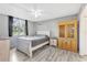 Comfortable bedroom featuring neutral walls, light wood floors, and a window at 2901 26Th W St # 204, Bradenton, FL 34205