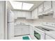 Efficient kitchen with white appliances and ample counter space at 2901 26Th W St # 204, Bradenton, FL 34205