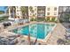 Gorgeous community pool and lounge area surrounded by well-maintained landscaping at 2901 26Th W St # 204, Bradenton, FL 34205